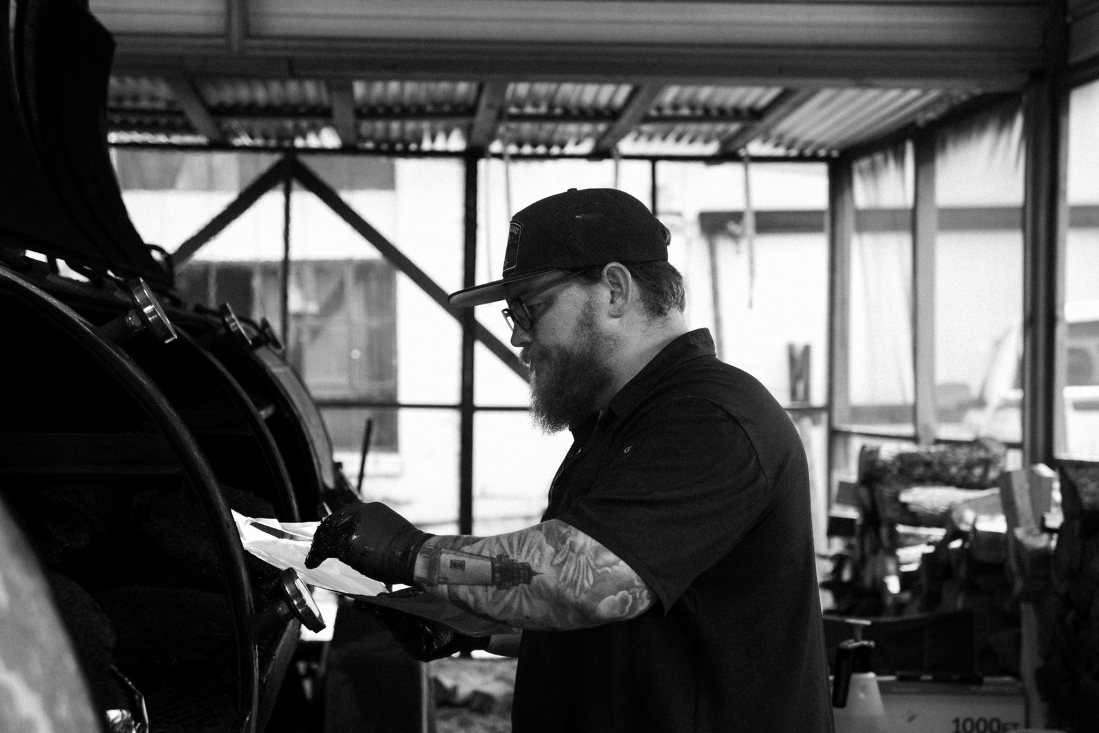 The Fourth Planet BBQ pitmaster prepping a catering order by the smokers