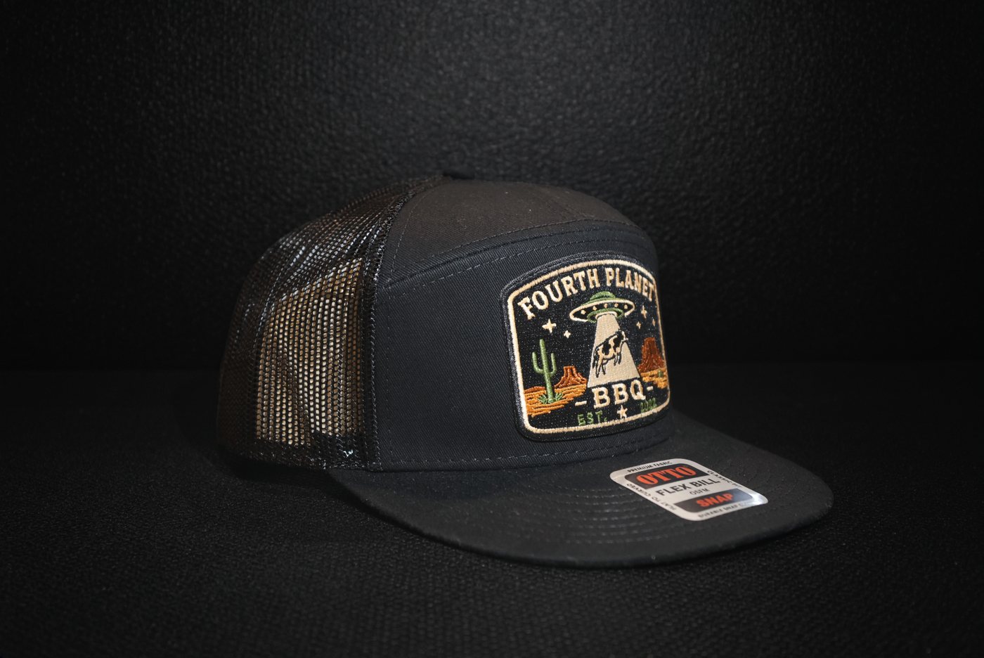 Black Fourth Planet BBQ trucker hat with the embroidered abduction patch