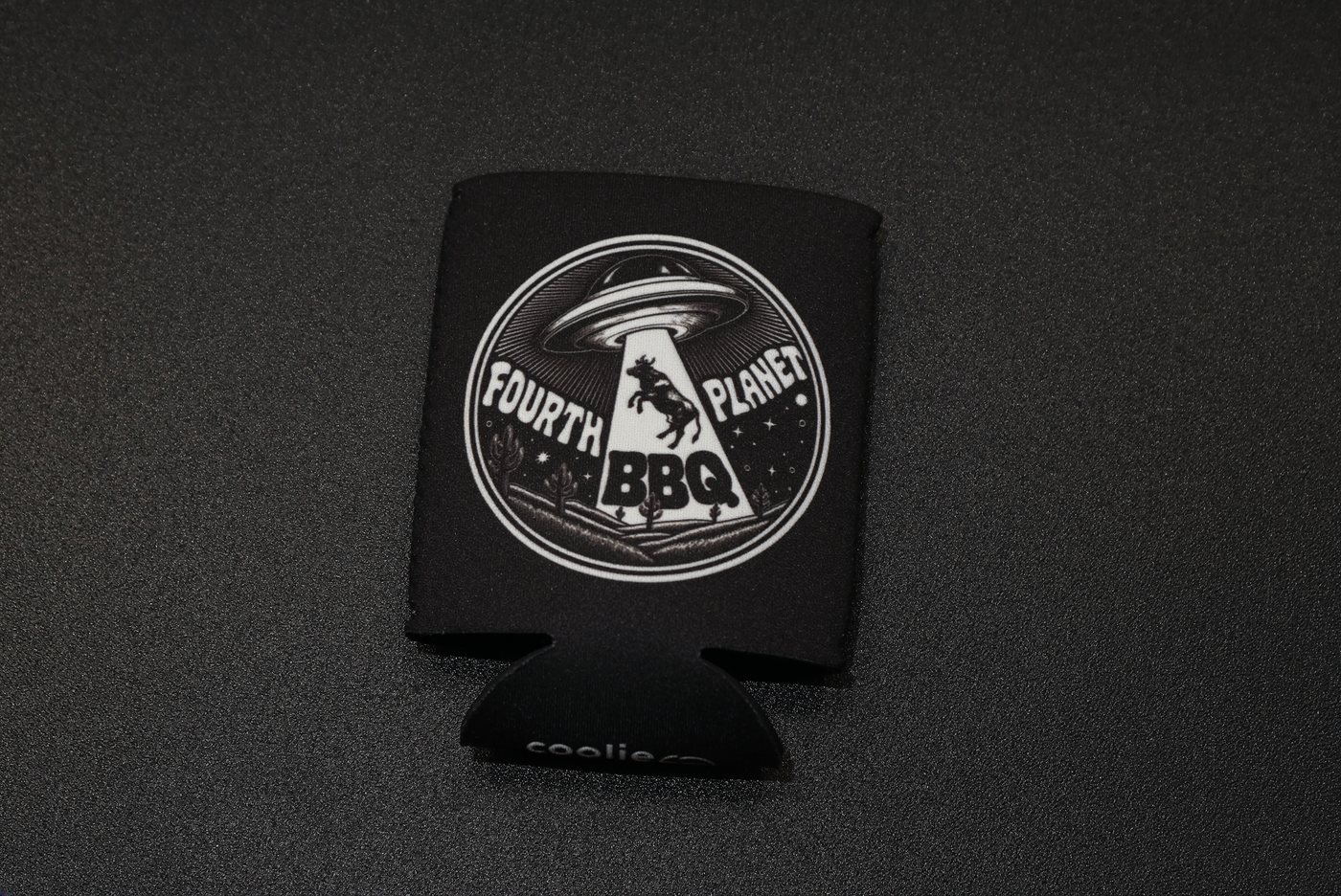 Black Fourth Planet BBQ koozie with the abduction crest on the front